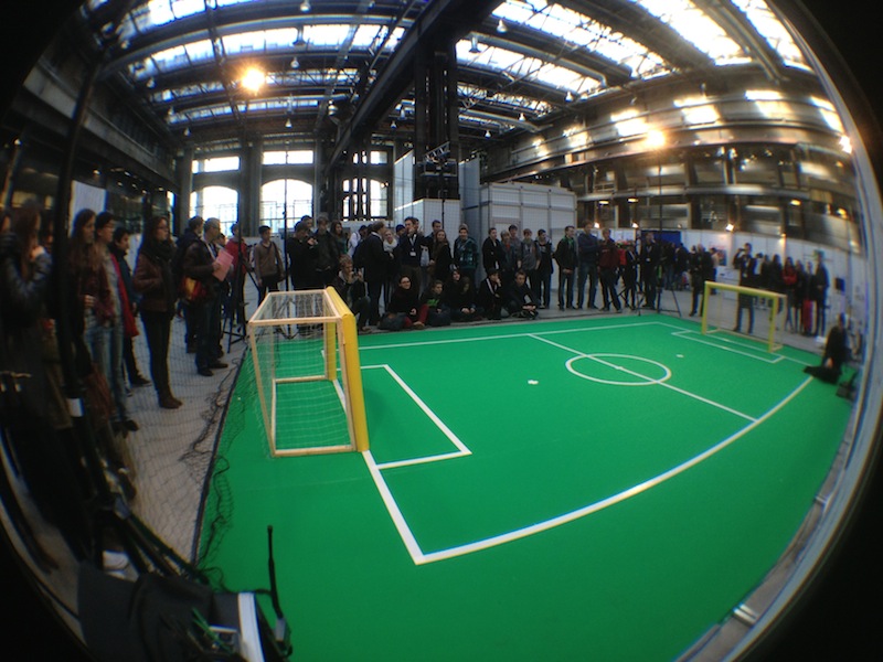 Students waiting for flying and soccer-playing robots