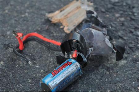 Boston Marathon bomb scene pictures taken by investigators show the remains of an explosive device