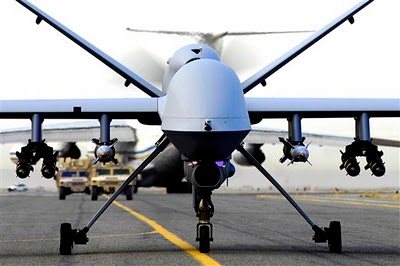 Armed with Hellfire missiles, General Atomics Predator drone prepares for take-off.