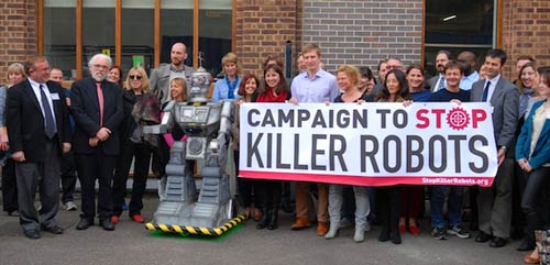 University of Sheffield (UK) AI and Robotics Professor Noel Sharkey (red tie) leading a group to protest killer robots.