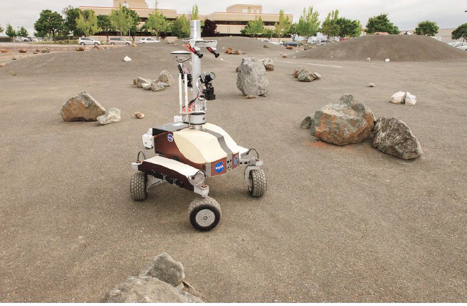 Photo credit: Dominick Hart/NASA. NASA's K10 rover at the Ames Research Center in Moffett Field, California performs a surface survey with its cameras and laser system, and then deployed a simulated polymide antenna while being controlled by an astronaut in space during a June 2013 test.