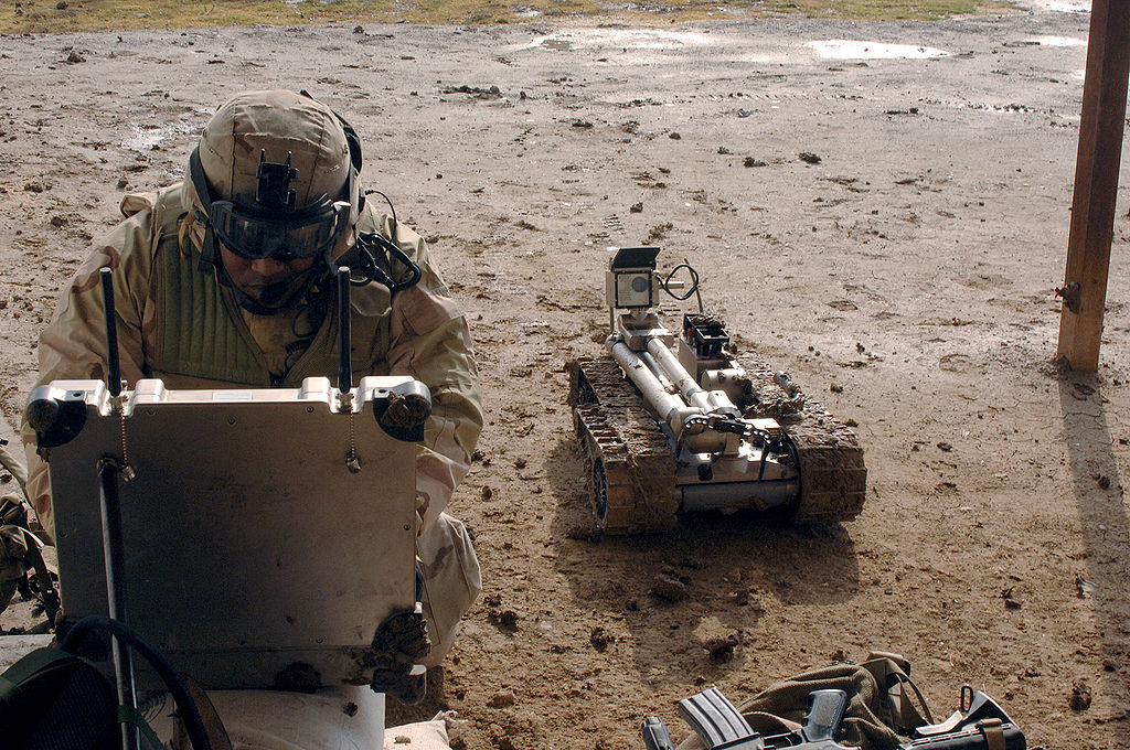 1024px-Military_robot_being_prepared_to_inspect_a_bomb