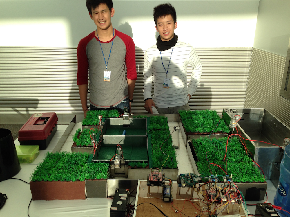 Sean Vince Ruel and John Raphael, of the Philippines, with their automatic rice paddy irrigation system.