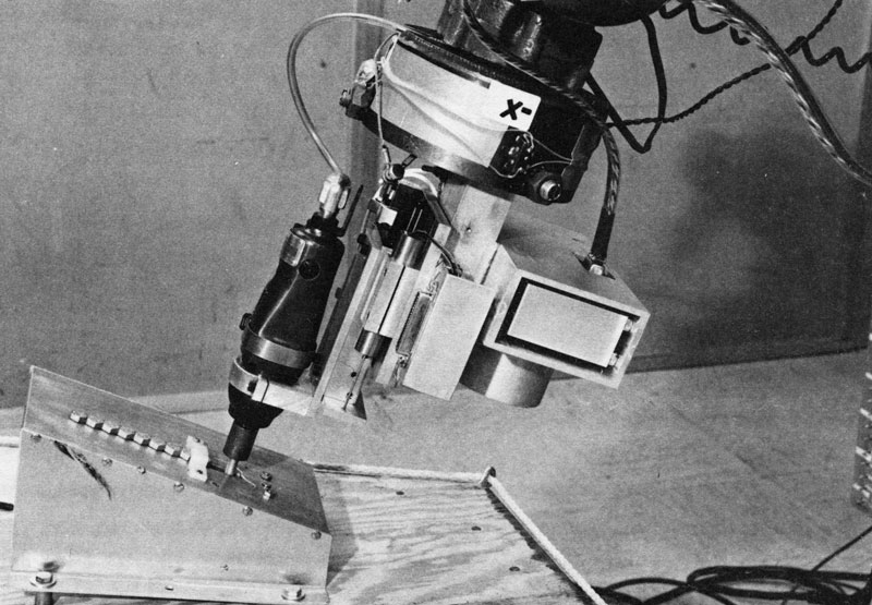 This image of a robot arm, developed by the Stanford Research Institute, is similar to the one that appeared in the 1976 NSF Annual Report. The robotic system used computer vision to identify and make decisions about parts on an assembly line. This is one of several projects from that era aimed at improving the productivity of American manufacturing processes. Credit: SRI International