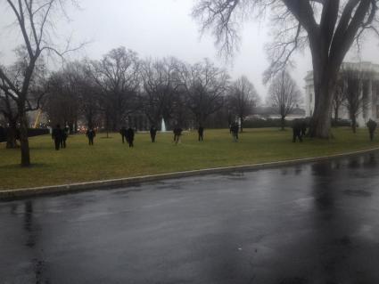 More than a dozen agents searching WH north lawn, w/ flashlights into the bushes. Source: Nedra Pickler.