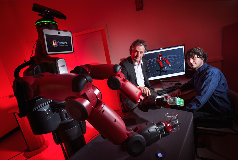 University of Maryland computer scientist Yiannis Aloimonos (center) is developing robotic systems able to visually recognize objects and generate new behavior based on those observations. Photo credit: John T. Consoli