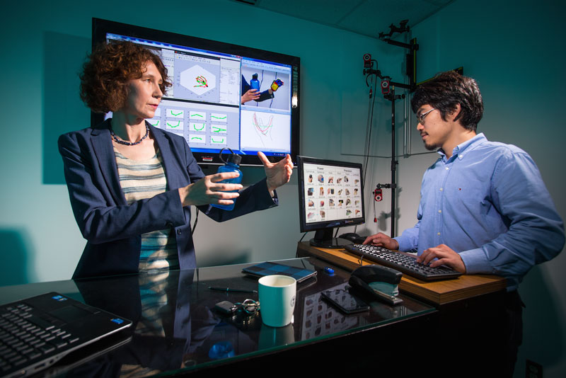 University of Maryland researcher Cornelia Fermuller (left) works with graduate student Yezhou Yang (right) on computer vision systems able to accurately identify and replicate intricate hand movements. Photo credit: John T. Consoli