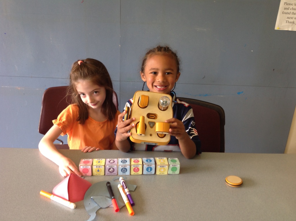 Kibo allows young tinkerers to build a robot using supplied modular components, personalize it with art designs and then program it to do their bidding using colored program blocks. Credit: DevTech research grouo, Tufts University