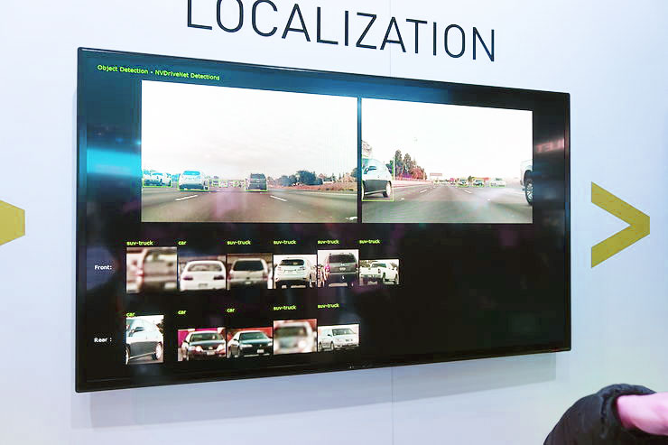 NVIDIA's software suite was shown off.  Here we see not the localization but the their computer vision system tagging cars and trying to identify them. Photo credit: Brad Templeton