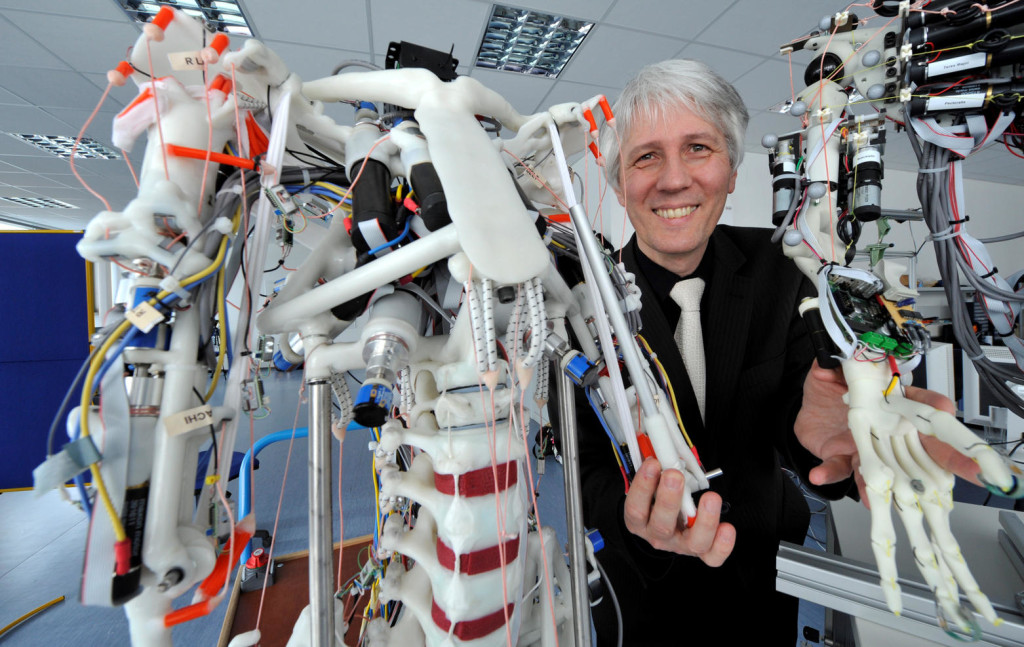 Professor Alois Knoll, chair of real-time systems and robotics, stands between two tendon driven robots developed as part of the EU project Eccerobot at the Technical University in Munich-Garching-Hochbrueck, Germany, 28 January 2013. Knoll coordinates the neuro-robotics division of the EU flagship project Human Brain Project (HBP). Photo: FRANK LEONHARDT