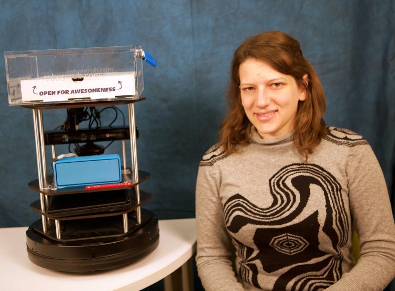 Serena Booth and her robot, Gaia, in its cookie-delivery disguise. (Photo by Adam Zewe/SEAS Communications.)