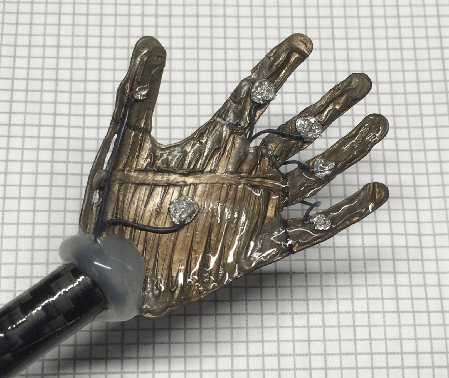 A small 3-D printed ionic polymer-metal composite soft robotic hand. National Science Foundation researchers are working to transform this material into artificial muscles. Credit: Kam K. Leang. University of Utah