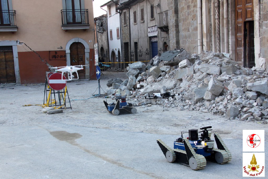 Two UGVs and two UAVs in front of the San Francesco church. Credit: TRADR project