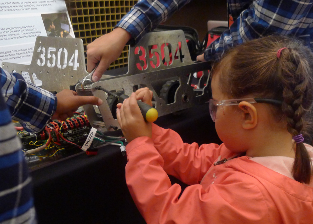   Young participant assembling the chassis at the White House Frontiers Conference in Pittsburgh, PA 