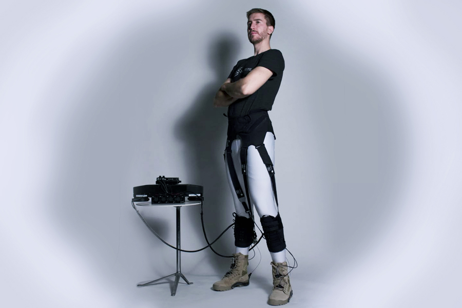 The Harvard team’s exosuit is a wearable robot that directly targets the ankle joints and is made of functional textiles, cable-based actuation and a biologically-inspired control system. In this version, actuation, electronics and battery units (shown on the left) have been off-boarded to better allow the researchers to quantify the exosuit’s energy-saving potential in healthy wearers. Credit: Wyss Institute at Harvard University