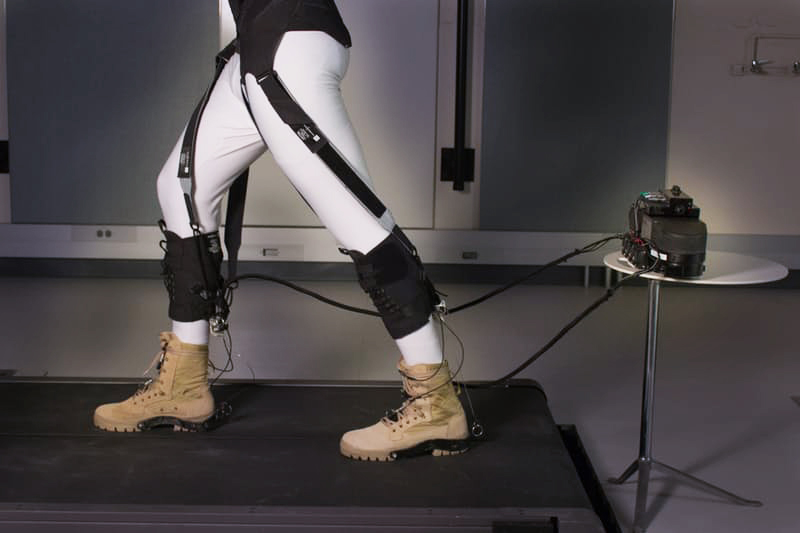 The exosuit’s soft textiles strategically position the actuating cables that assist with the ankle motion at the back of the lower legs and, through additional straps, transfer energy produced at the ankle to the front of the hip to also assist with the gait’s hip motion. Credit: Wyss Institute at Harvard University