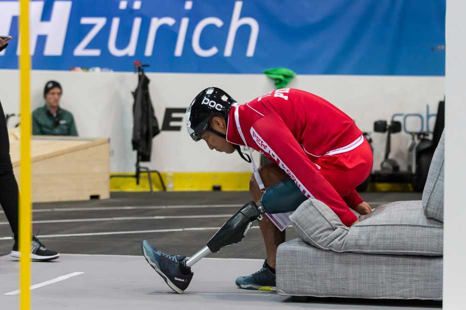 Competitor getting up from sofa